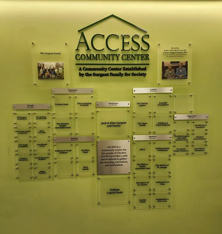 A B&D layered acrylic donor recognition wall for the ACCESS Community Center, with tiered giving levels and donor name plates.