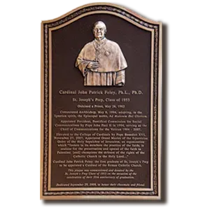 A B&D cast bronze bas-relief memorial plaque with a sculpted portrait and engraved tribute.