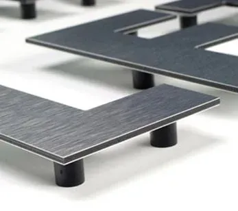 Precision-cut custom metal letters ready for mounting.