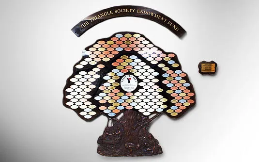 B&D Classic Donor Tree with a custom cast bronze trunk created for the Westfield YMCA, engraved metal leaves arranged across an acrylic panel.