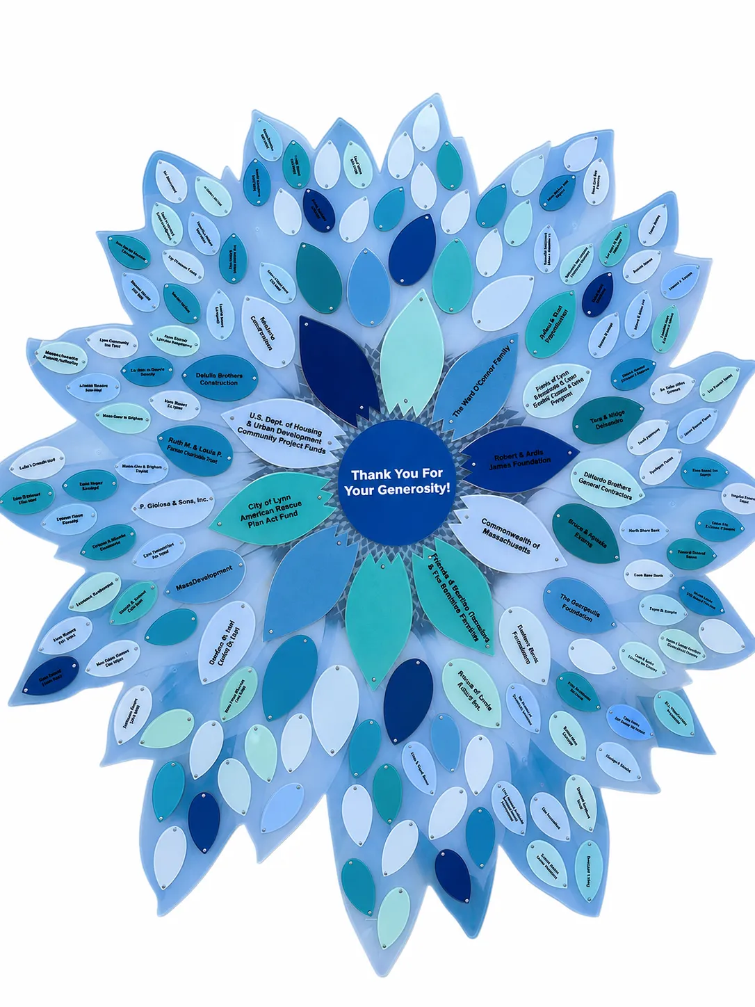 A B&D donor recognition flower in a blue palette — engraved petals in shades of blue around a “Thank You For Your Generosity” center.