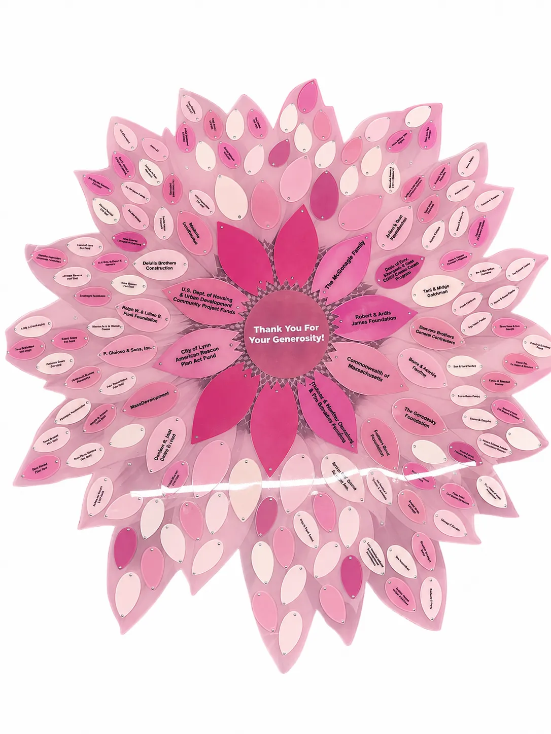 A B&D donor recognition flower in a pink palette, with engraved donor petals.