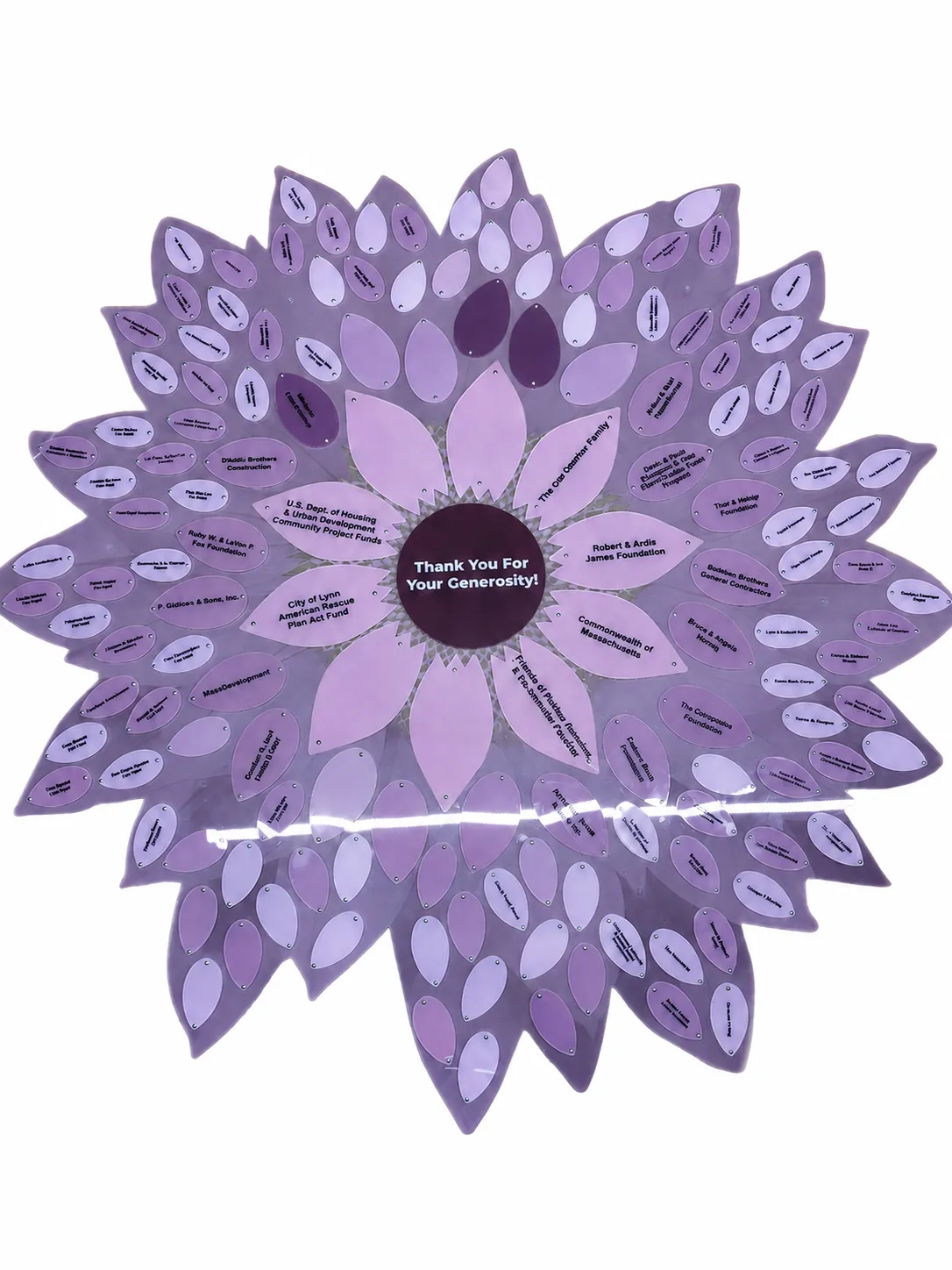 A B&D donor recognition flower in a purple palette, with engraved donor petals.