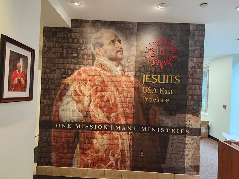 Engraved donor welcome wall at Jesuit High School East, recognizing supporters of the faith-based school community.