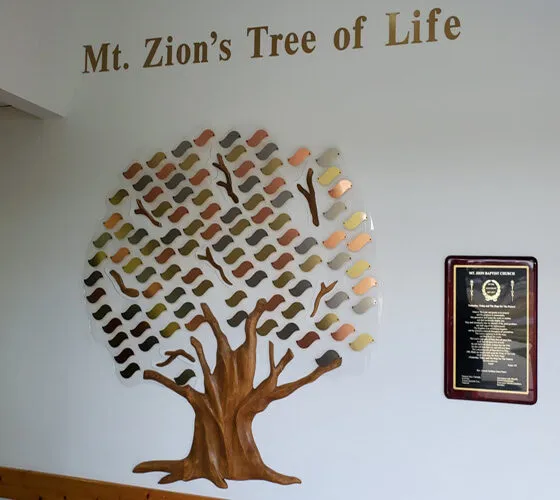 A custom donor recognition tree with engraved leaves honoring individual gifts