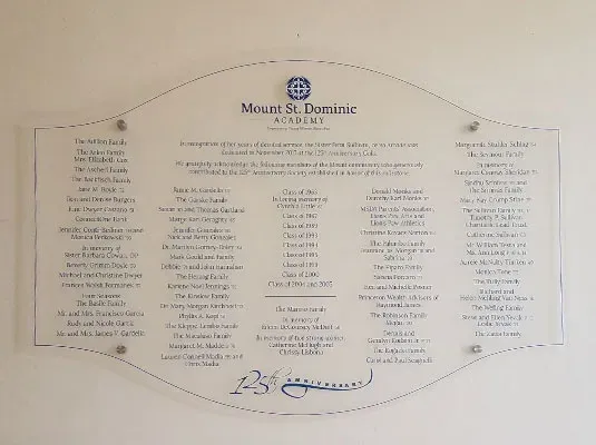 A permanent donor display combining engraved plaques and a vinyl wall mural into a fixed, lasting tribute.