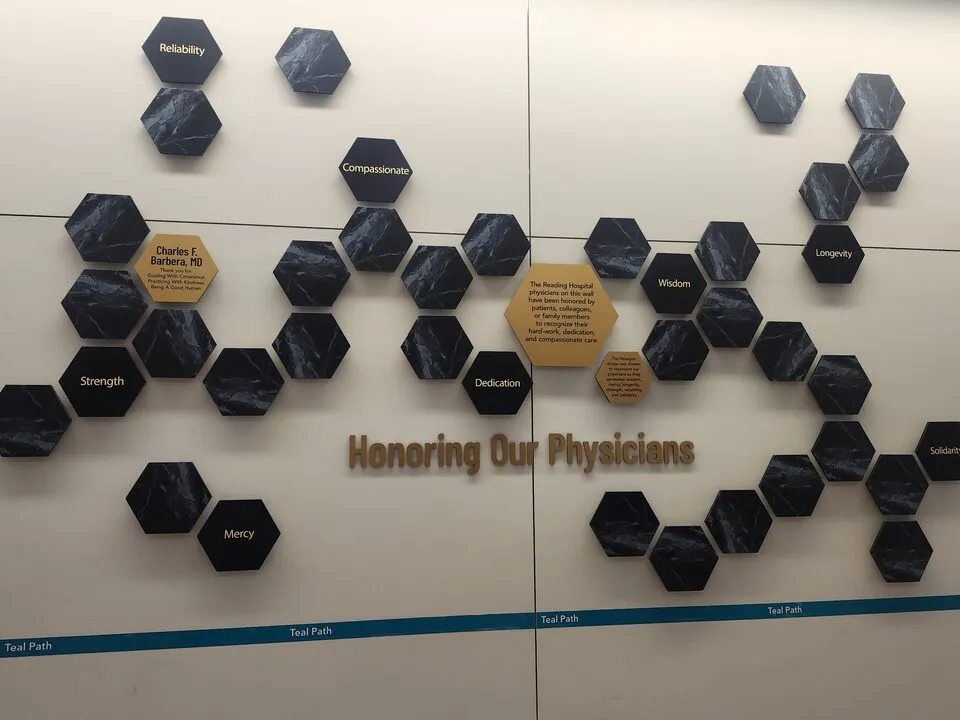 A B&D physician donor recognition wall at Reading Hospital, with marble hexagon plaques honoring physicians by name.