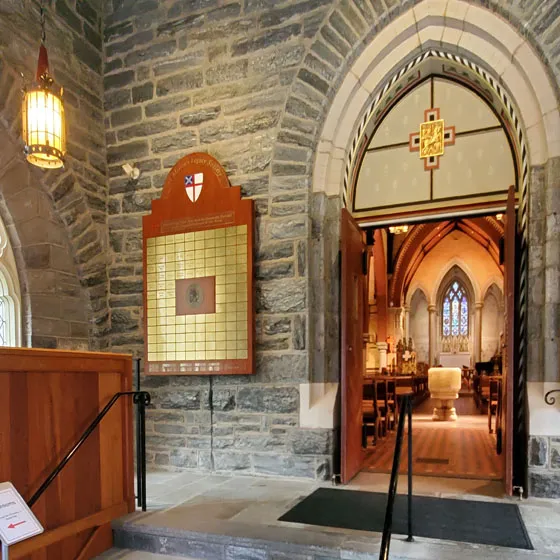 Donor recognition wall at St. Martin-in-the-Fields, with framed honor-roll panels listing congregation donors.