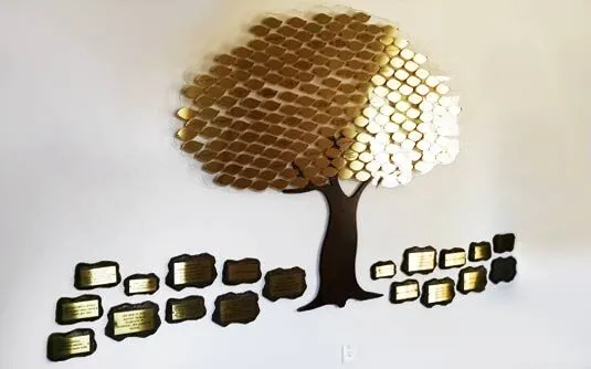 A B&D Value Tree — an affordable donor recognition tree with gold brass leaves arranged on a laser-cut acrylic background.