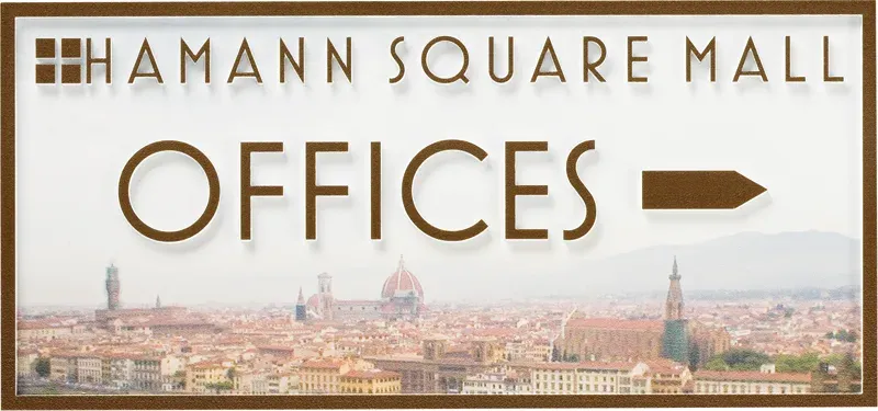 A B&D wayfinding directional sign system guiding visitors through an office building.