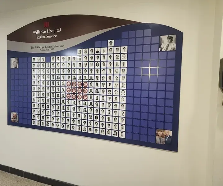 A B&D custom recognition wall for the Wills Eye Hospital Retina Service — a photo-tile honor display of the fellowship's members, established 1960.